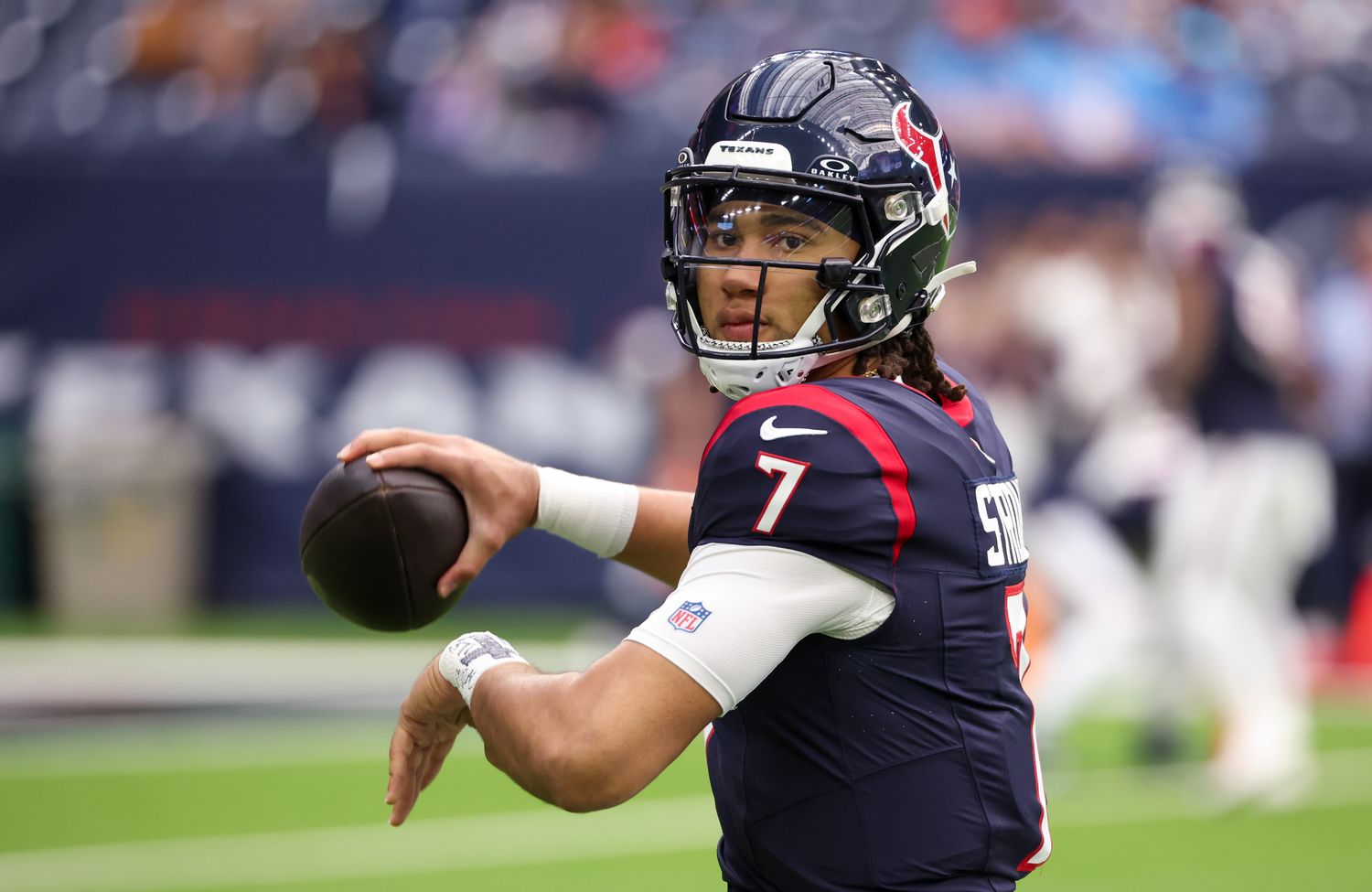 Texans quarterback C.J. Stroud (7) warms up before playing against the Tennessee Titans at NRG Stadium.